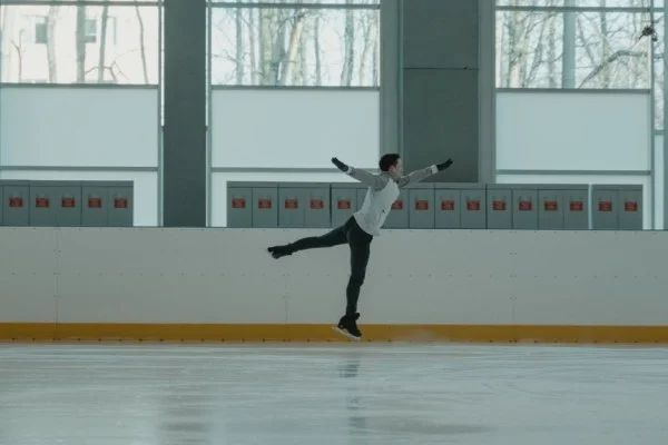 male figure skater jumping